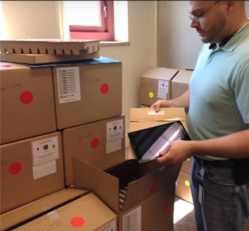Opening boxes of iPads 